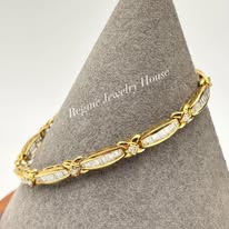 Gold & Baguette Diamond "XOXO" Link Bracelet Highlights: