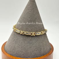 Gold & Baguette Diamond "XOXO" Link Bracelet Highlights: